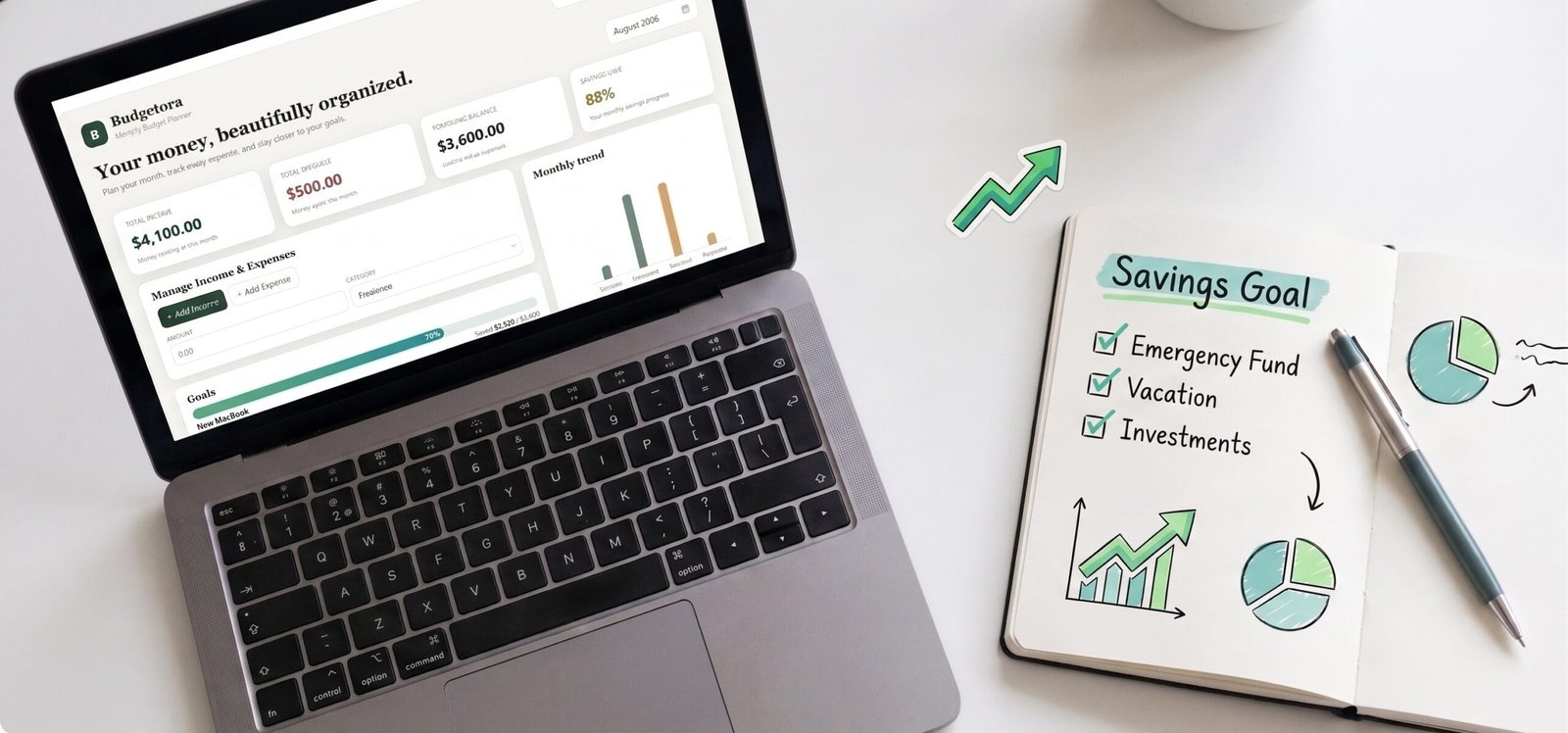 Digital budget planner on laptop paired with a printable savings goal tracker and financial charts.